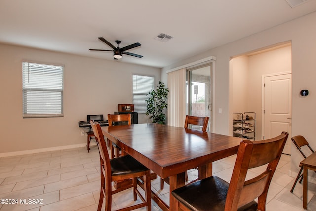 dining area featuring light tile patterned flooring and ceiling fan