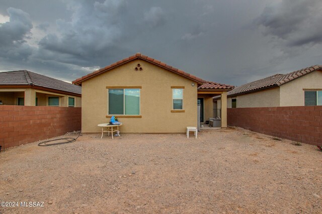 back of house with a patio area