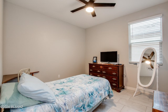 bedroom featuring light tile patterned flooring and ceiling fan