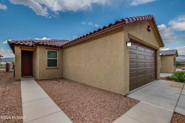 view of property exterior featuring a garage