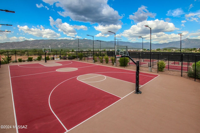 view of basketball court with a mountain view