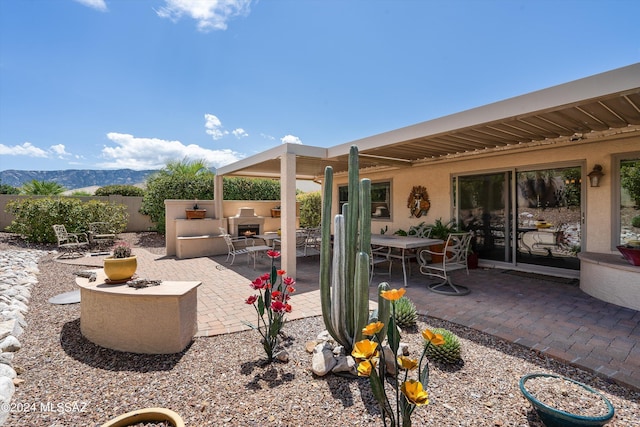 view of patio with a mountain view and outdoor lounge area