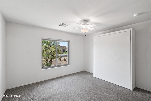 unfurnished bedroom featuring carpet flooring and ceiling fan