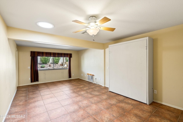 unfurnished bedroom featuring ceiling fan and tile patterned floors