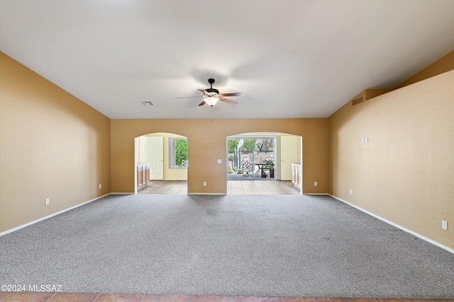 carpeted empty room featuring ceiling fan