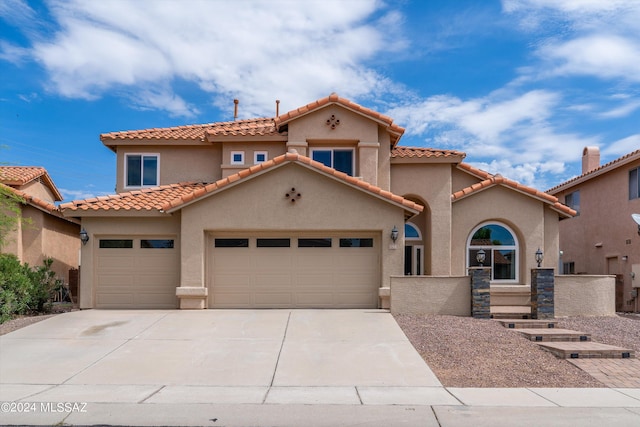 mediterranean / spanish-style home featuring a garage