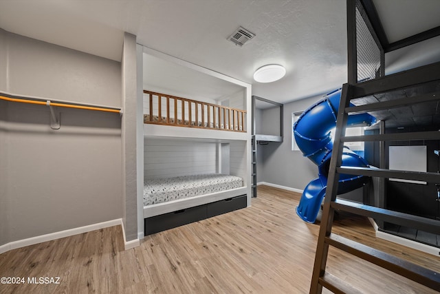 bedroom with hardwood / wood-style floors