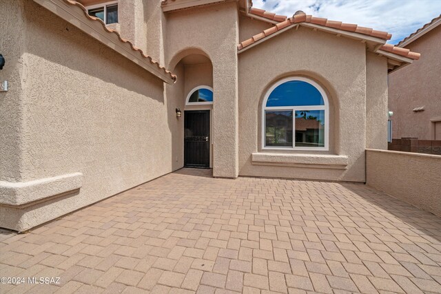 view of patio featuring a garage and a mountain view