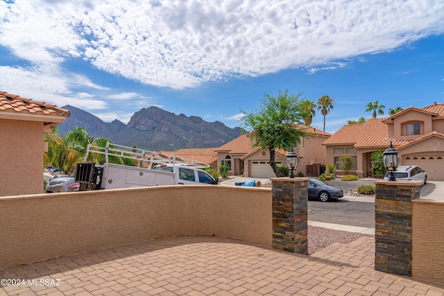 view of patio / terrace with a balcony and a mountain view