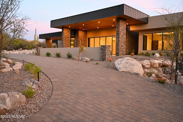 2155 E Desert Garden Dr, Tucson, AZ 85718 - view of front of property with stone siding, driveway, and stucco siding