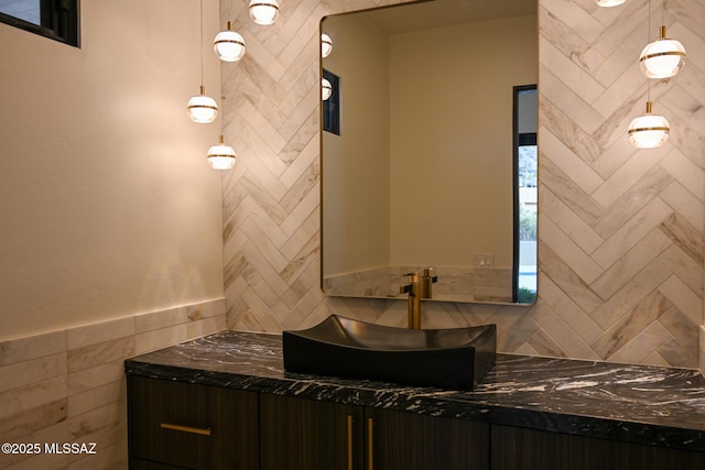2155 E Desert Garden Dr, Tucson, AZ 85718 - bathroom with tile walls and a sink