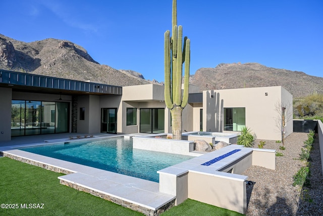 2155 E Desert Garden Dr, Tucson, AZ 85718 - rear view of property featuring an outdoor pool, stucco siding, a hot tub, a mountain view, and a patio area