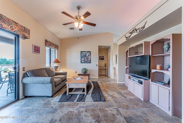 living area with visible vents, baseboards, vaulted ceiling, a ceiling fan, and stone finish flooring