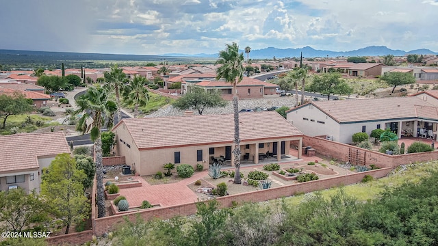 birds eye view of property featuring a mountain view