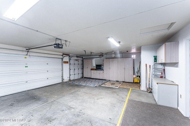 garage featuring a garage door opener