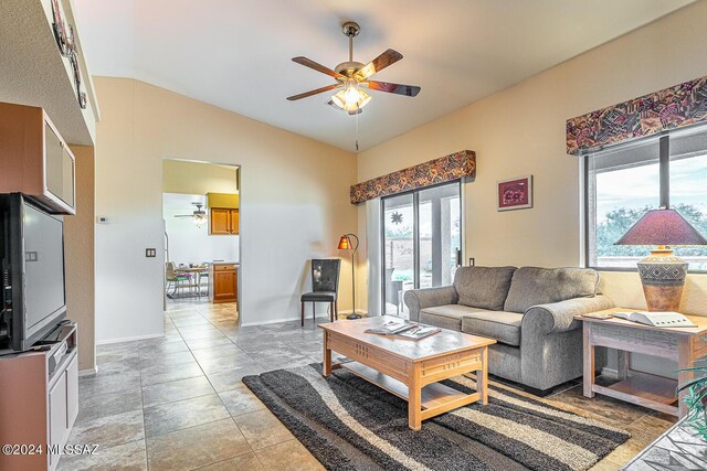 living room featuring lofted ceiling