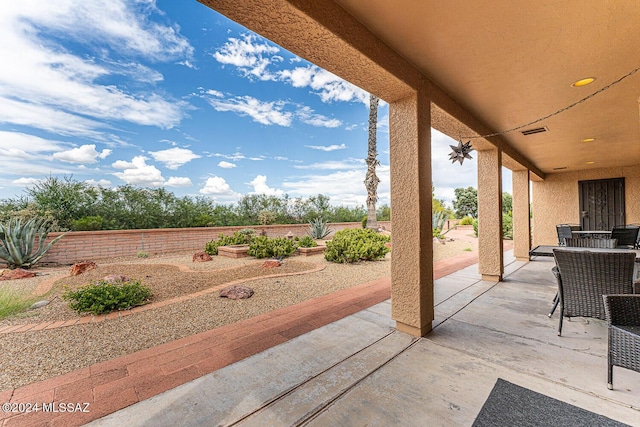 view of patio with fence