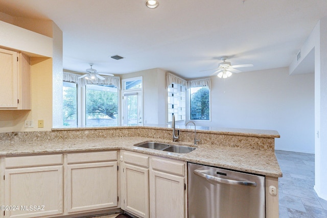 kitchen featuring ceiling fan, plenty of natural light, sink, and stainless steel dishwasher