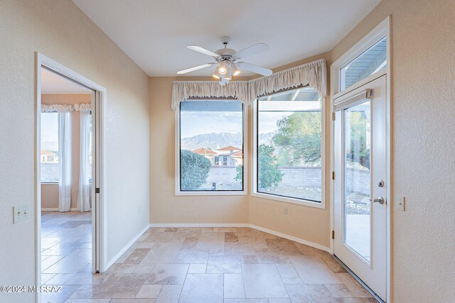 spare room with ceiling fan