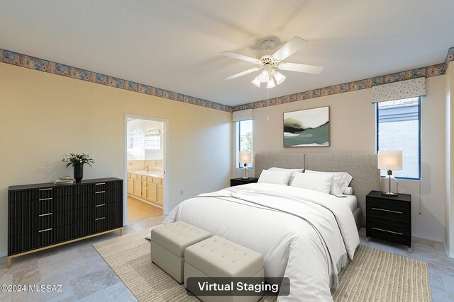 bedroom with ceiling fan, connected bathroom, and multiple windows