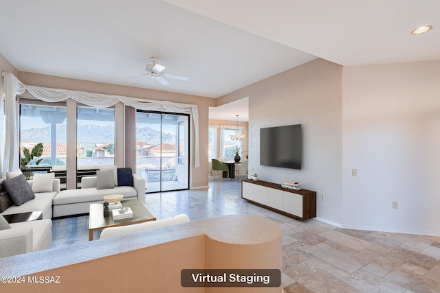 living room with ceiling fan and a mountain view