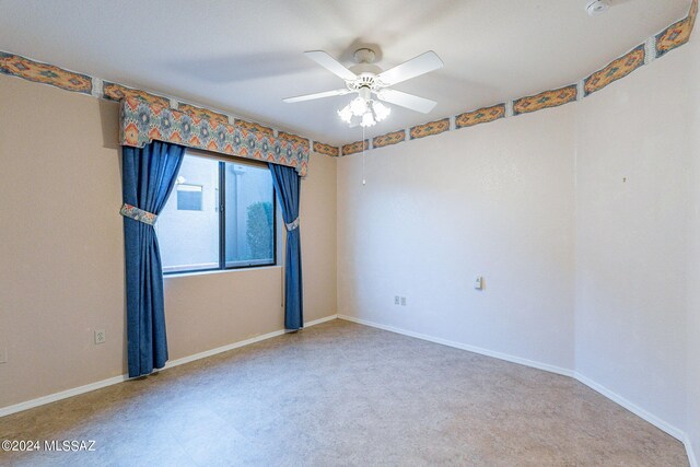 spare room featuring ceiling fan