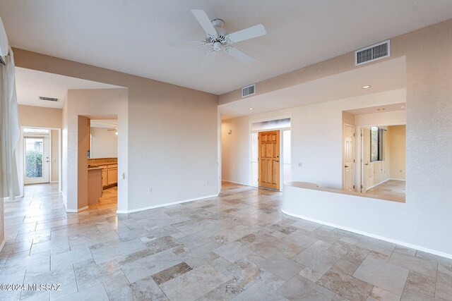 empty room featuring ceiling fan