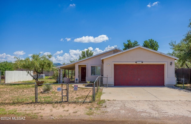 ranch-style house featuring a garage