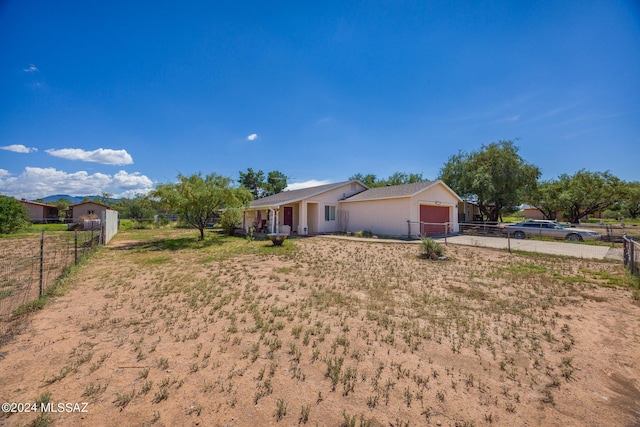 ranch-style home featuring a garage