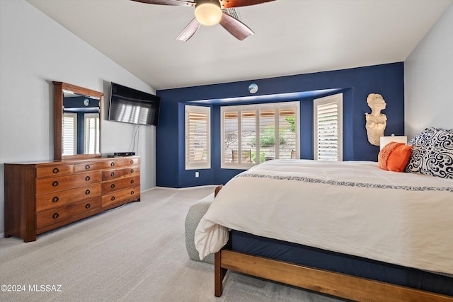 bedroom featuring light colored carpet, ceiling fan, and vaulted ceiling