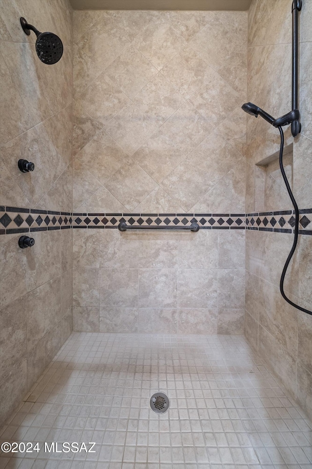 bathroom with tiled shower