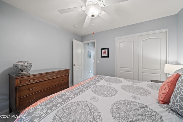 bedroom featuring ceiling fan and a closet