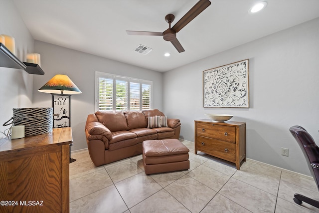 tiled living room featuring ceiling fan