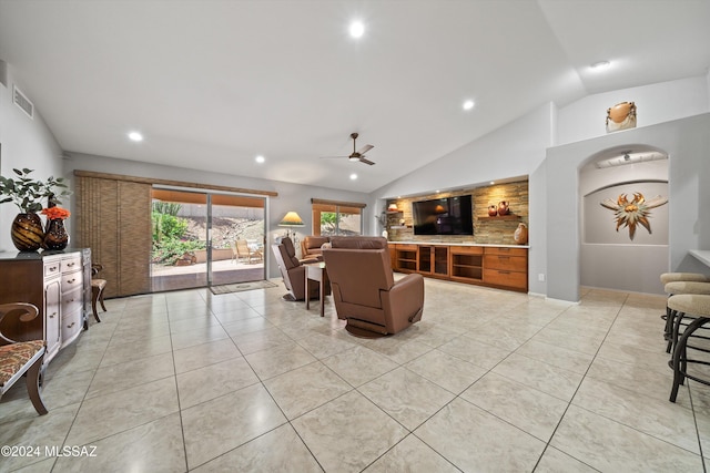 living room featuring light tile patterned floors, vaulted ceiling, and ceiling fan