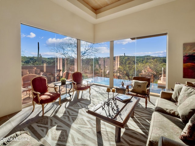 sunroom / solarium with a tray ceiling