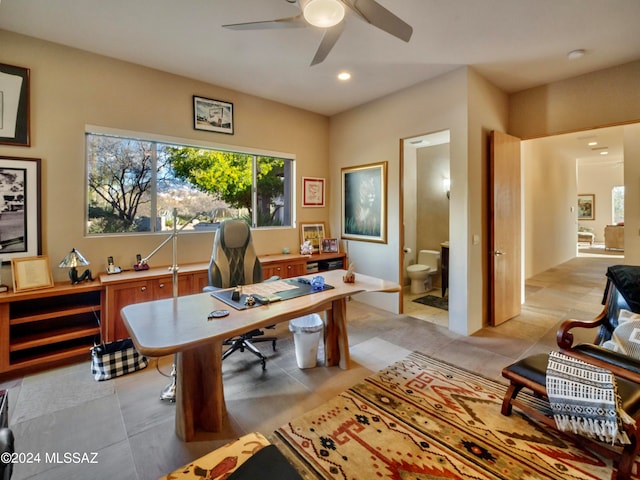 office space with light tile patterned flooring and ceiling fan