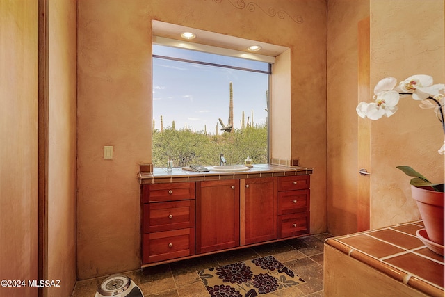 interior space featuring sink and tile counters