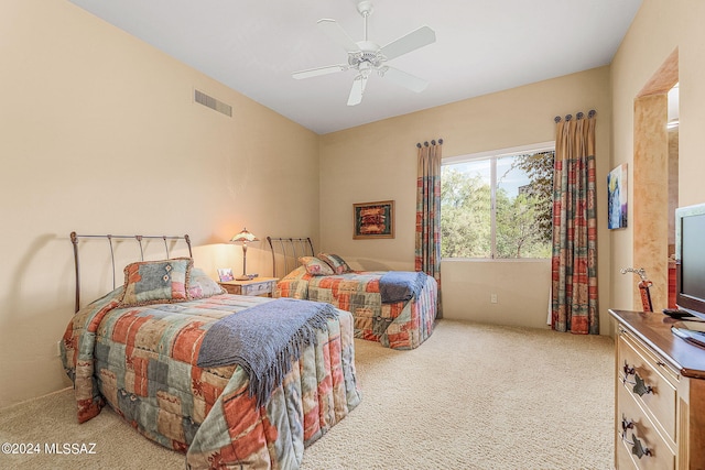 carpeted bedroom with ceiling fan