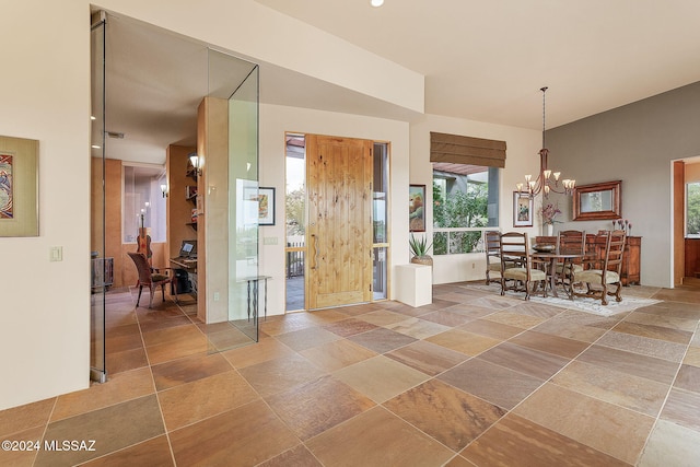 foyer featuring a chandelier