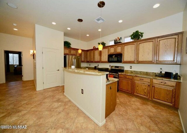 kitchen with hanging light fixtures, range, a center island, stainless steel fridge, and light tile patterned floors