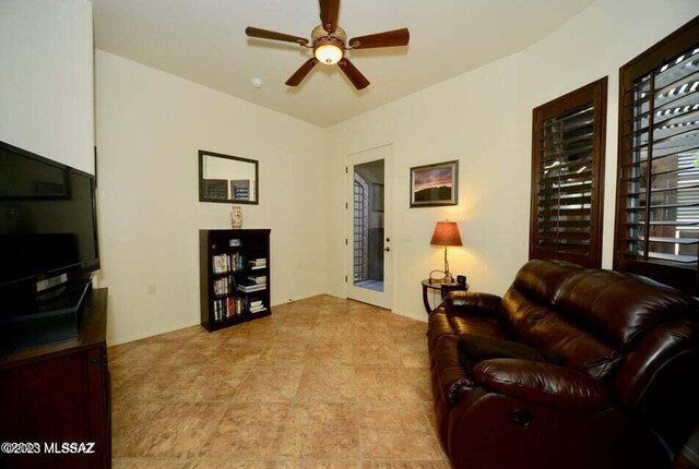 home office with carpet flooring and ceiling fan