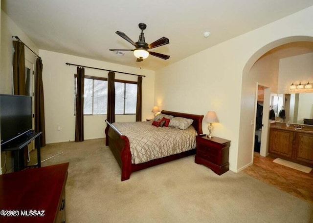 bedroom featuring light tile patterned flooring and ceiling fan