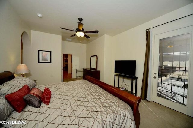 carpeted bedroom featuring access to outside and ceiling fan