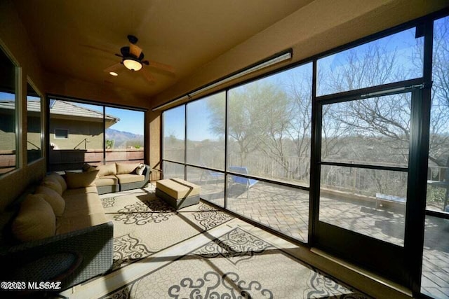 sunroom / solarium with ceiling fan