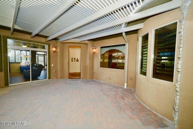 corridor with a notable chandelier and tile patterned flooring