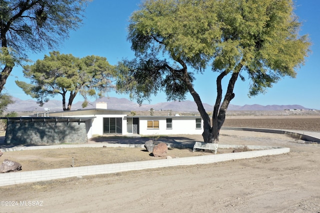 view of front of home featuring a mountain view