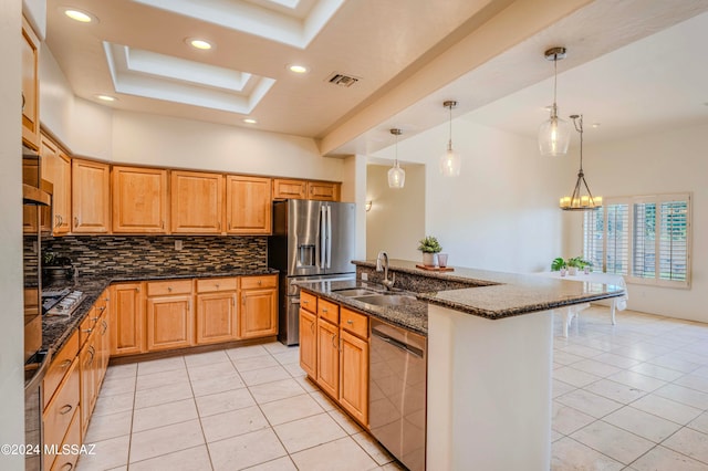 kitchen featuring light tile patterned flooring, stainless steel appliances, a kitchen island with sink, backsplash, and a skylight