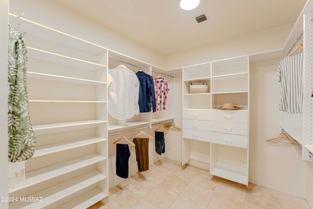 walk in closet featuring light tile patterned floors