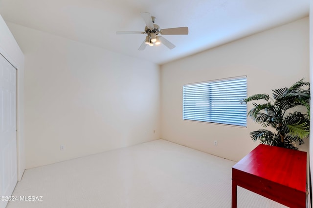 home office featuring carpet flooring and ceiling fan