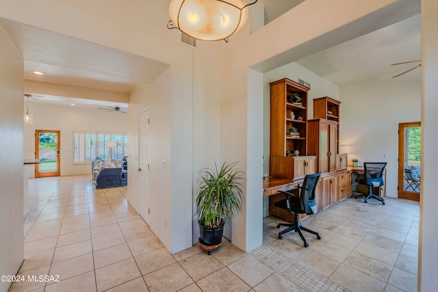 tiled office featuring ceiling fan and plenty of natural light